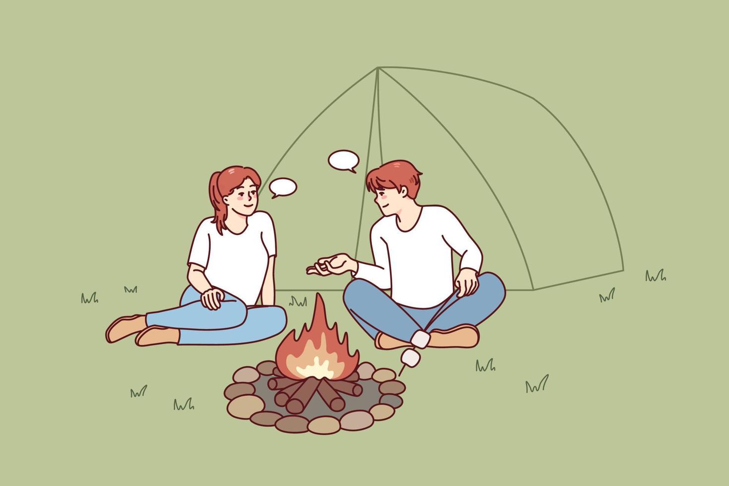 نمادین دختر و پسری از اهالی کلاردشت یک چادر و آتشی که کنار آن آتشی برپاست